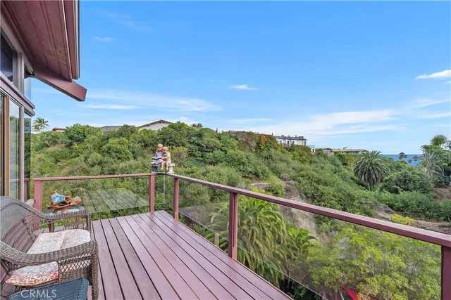 a kitchen with stainless steel appliances granite countertop a sink refrigerator and cabinets