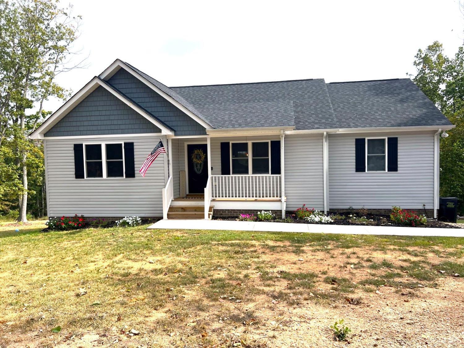 1226 Mountain Cut Road Appomattox, VA 24522 - Photo 1 of 22 a house that has a large tree in front of it