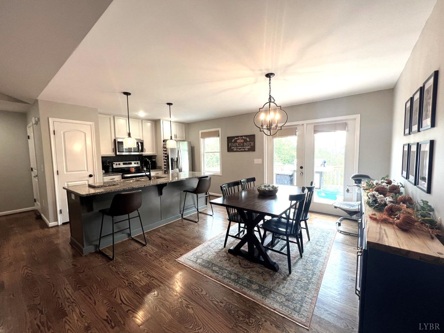 1226 Mountain Cut Road Appomattox, VA 24522 - Photo 3 of 22 a kitchen with sink cabinets and wooden floor