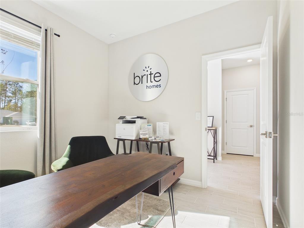 7110 Southwest 133rd Lane Ocala, FL 34473 - Photo 20 of 38 a bedroom with a bed and a table in it