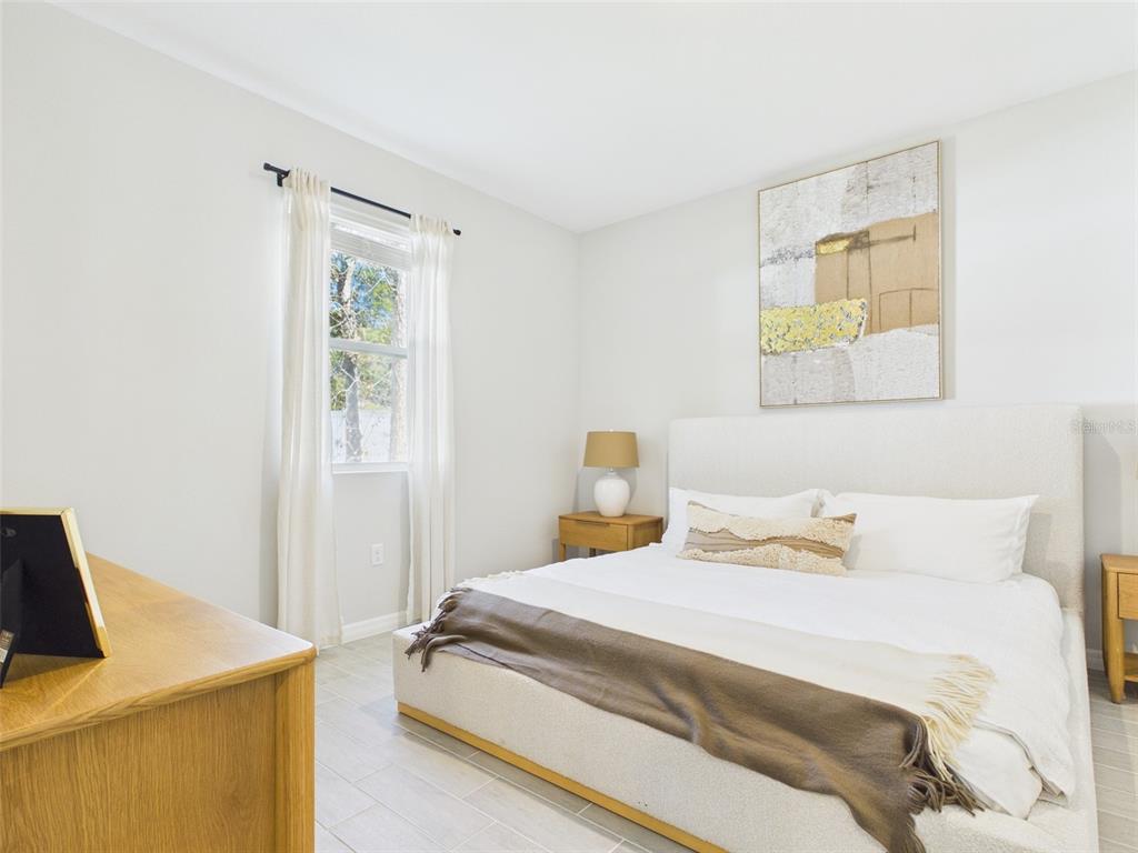 7110 Southwest 133rd Lane Ocala, FL 34473 - Photo 22 of 38 a bedroom with a bed and a window