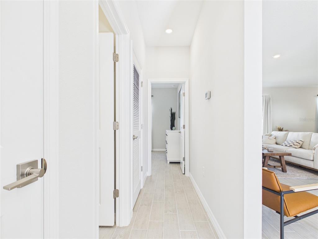 7110 Southwest 133rd Lane Ocala, FL 34473 - Photo 29 of 38 a view of a bedroom with a bed and hallway