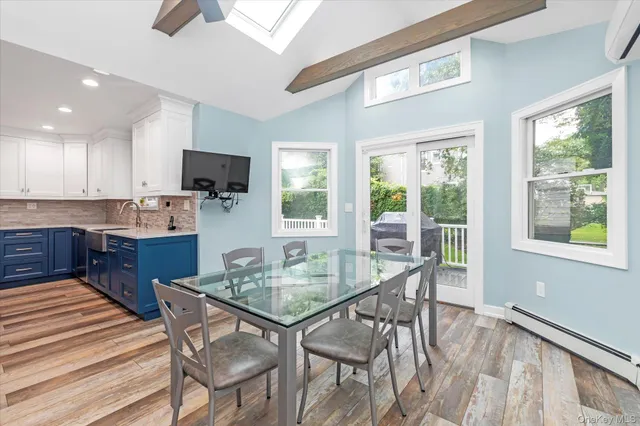 a dining room with furniture and window