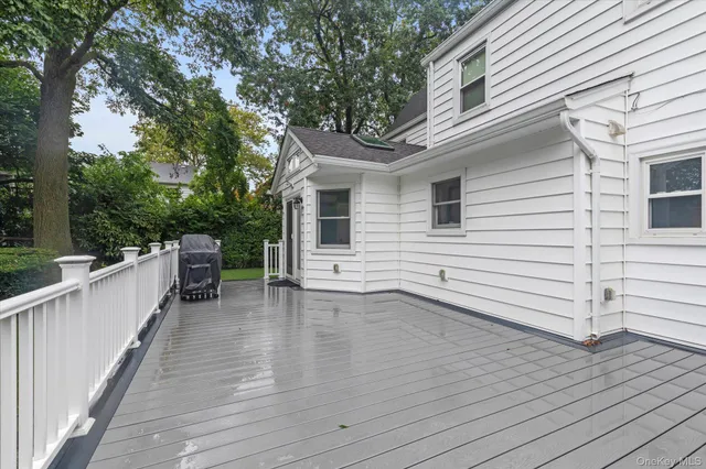 a view of a terrace with wooden floor and fence