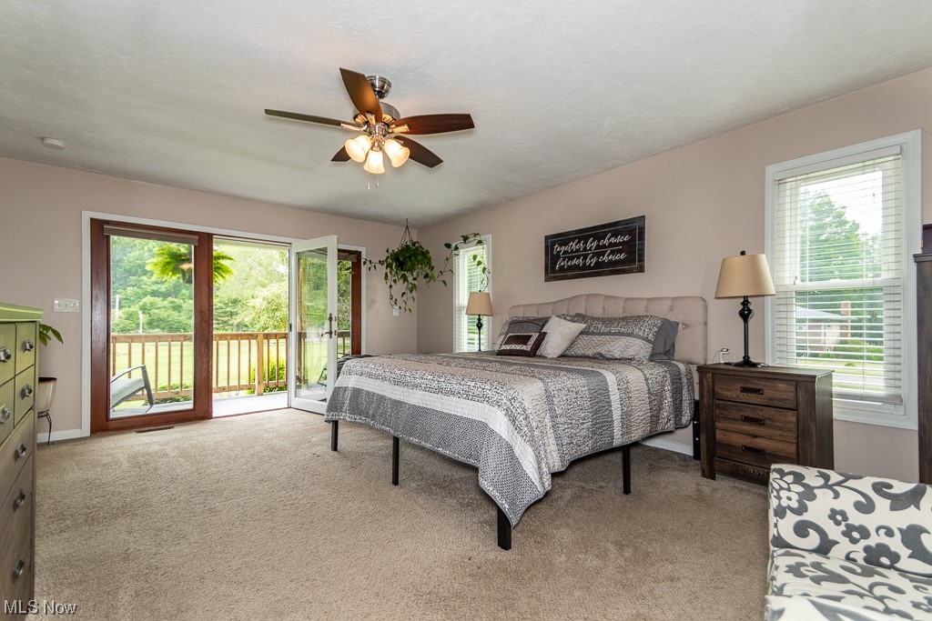 1540 Dock Road Madison, OH 44057 - Photo 11 of 34 Carpeted bedroom featuring a wonderful private side deck