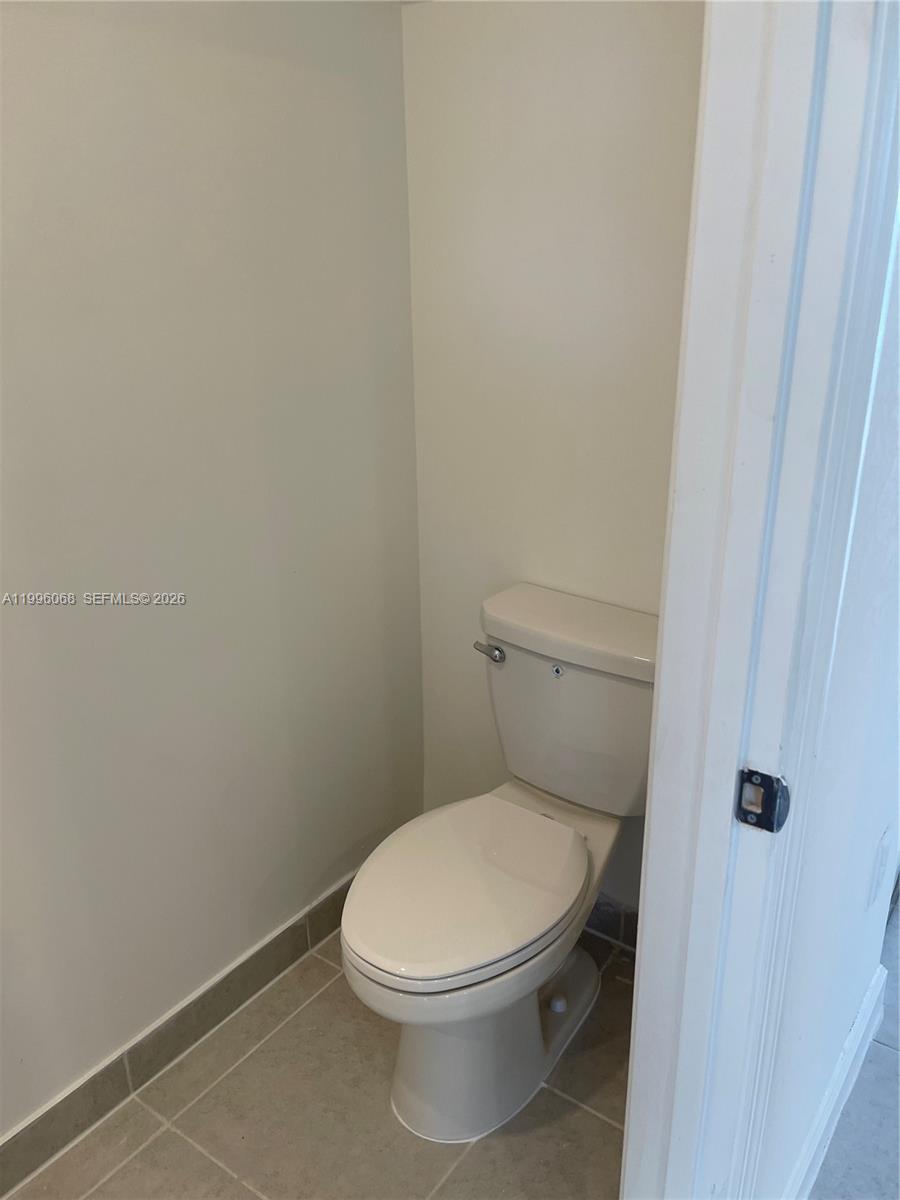 13262 Southwest 287th Terrace Homestead, FL 33033 - Photo 33 of 33 a white toilet sitting next to a shower