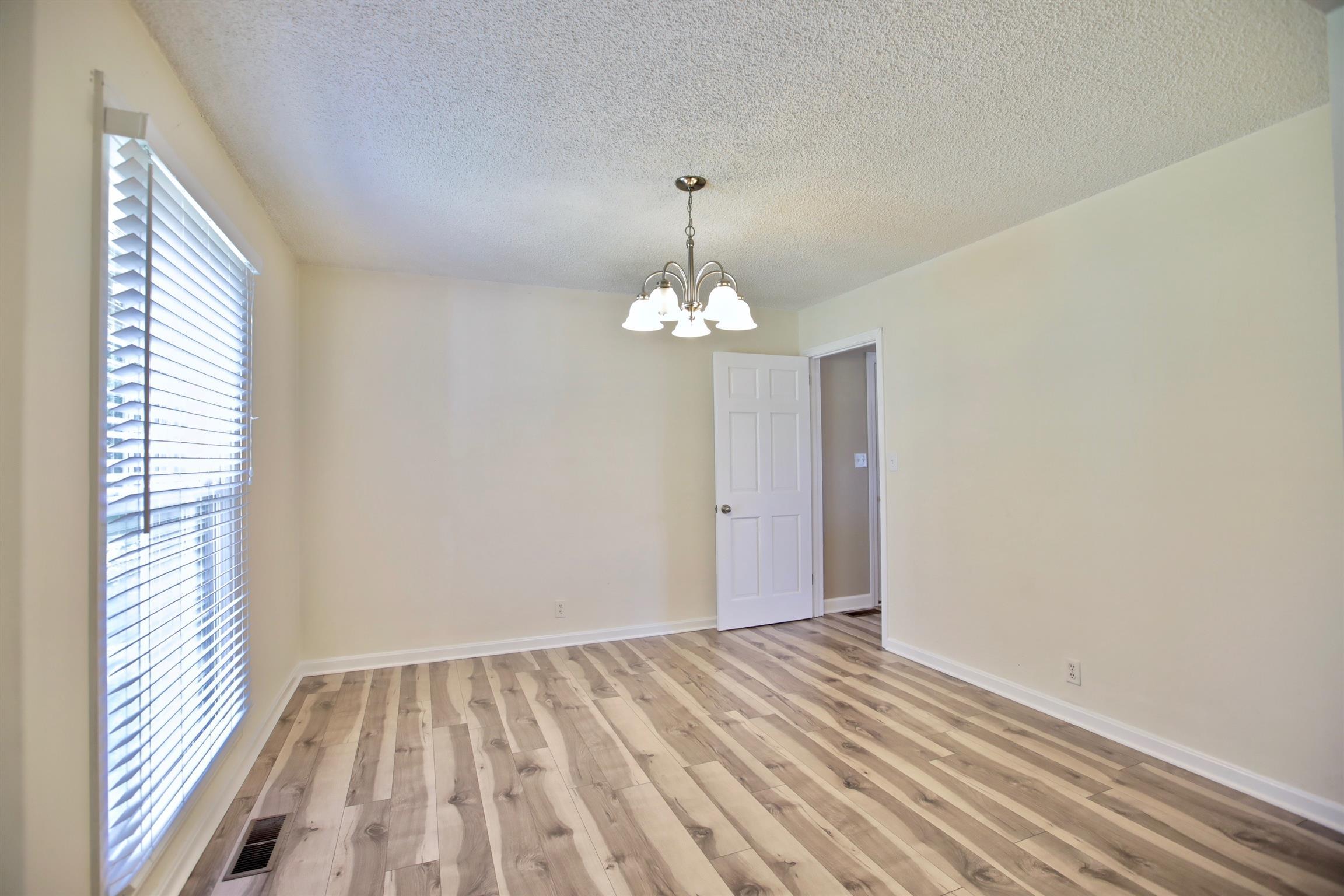 2674 New Hall Road Greenbrier, TN 37073 - Photo 14 of 30 a view of empty room with wooden floor and fan