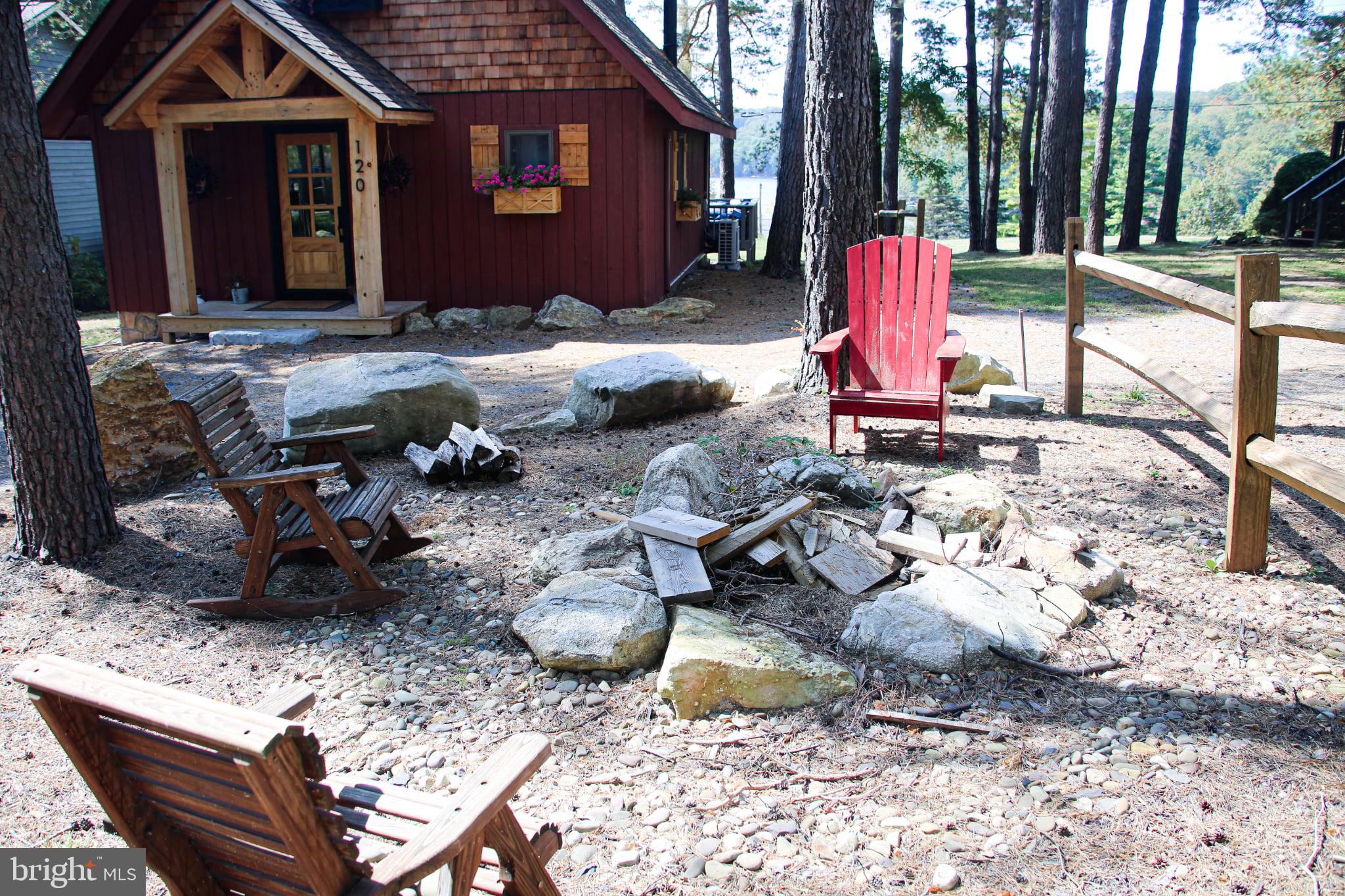 120 Rock Lodge Road McHenry, MD 21541 - Photo 2 of 23 fire pit between garage and home