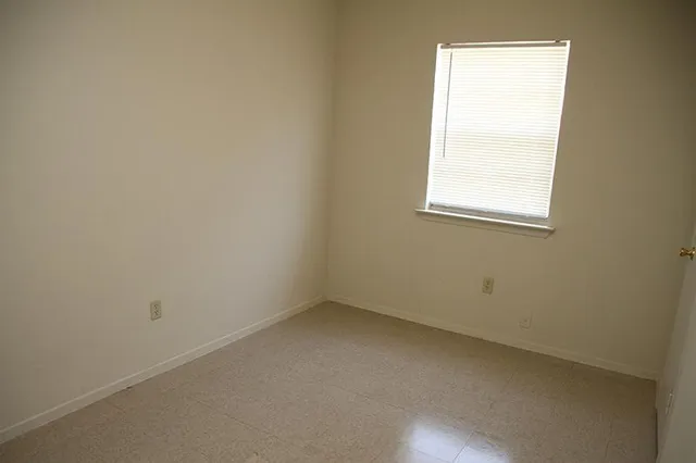 a white toilet sitting next to a bath tub