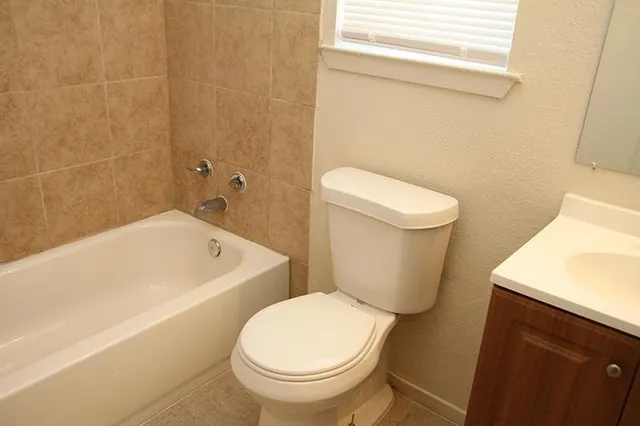 a kitchen with a cabinets and wooden floor