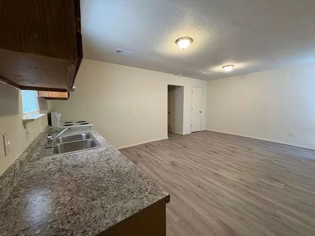 a bathroom with a toilet a sink and bathtub