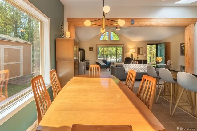 a spacious bedroom with a large bed and a large window