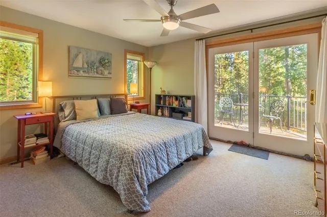 a bed room with a bed and a chandelier