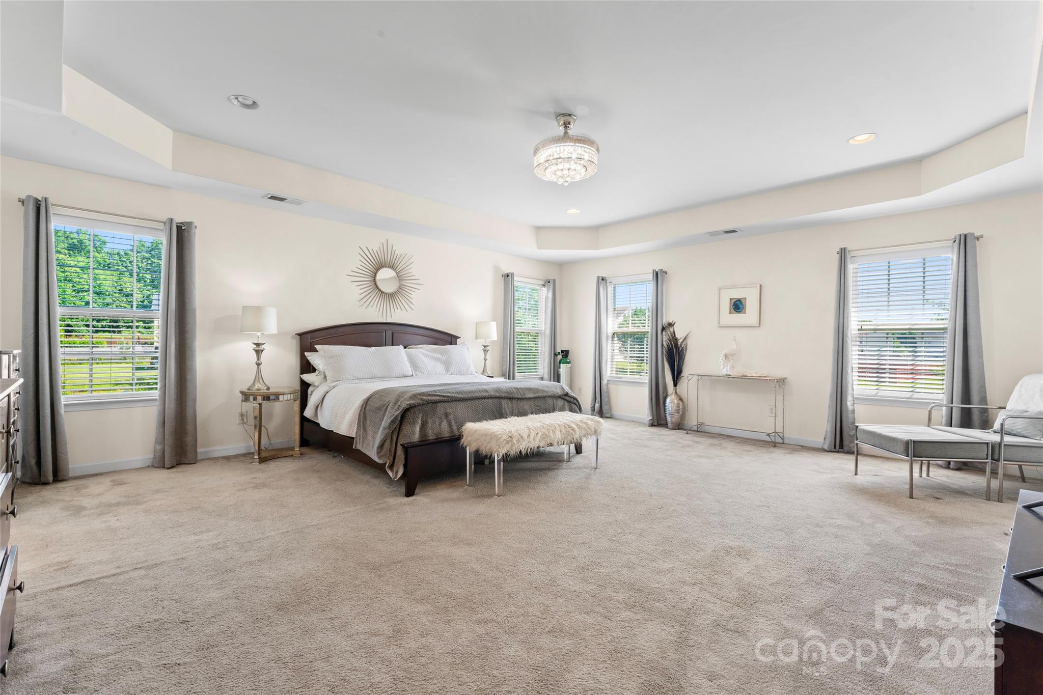 2909 Blueberry Drive Monroe, NC 28110 - Photo 20 of 37 a spacious bedroom with a bed and large windows