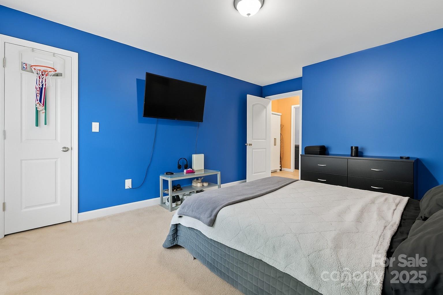 2909 Blueberry Drive Monroe, NC 28110 - Photo 25 of 37 a bedroom with a bed and a flat screen tv