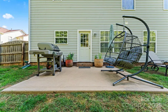 a backyard of a house with seating space