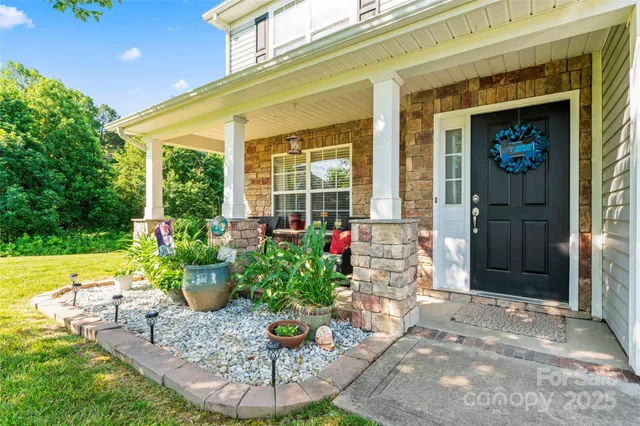 a front view of a house with outdoor seating