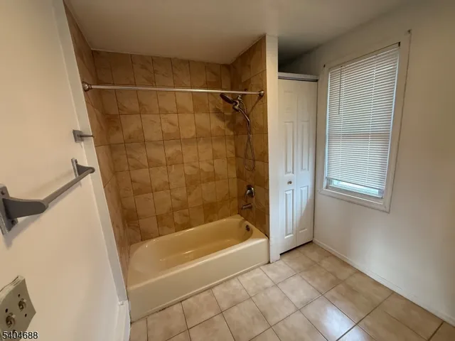 a view of dirt yard with large trees