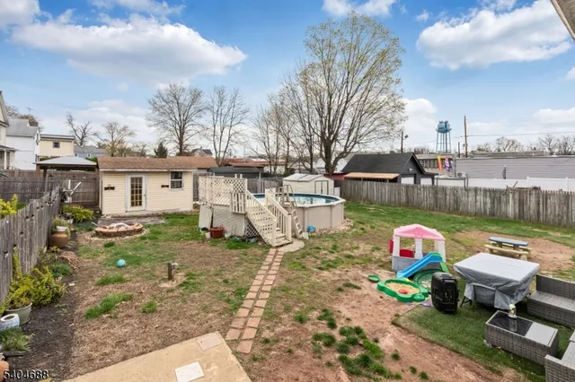 a room with a bed and a chandelier