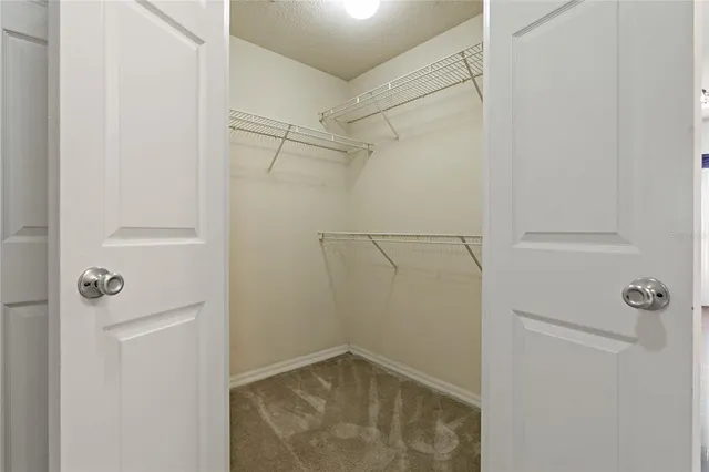 a living room with furniture and a piano