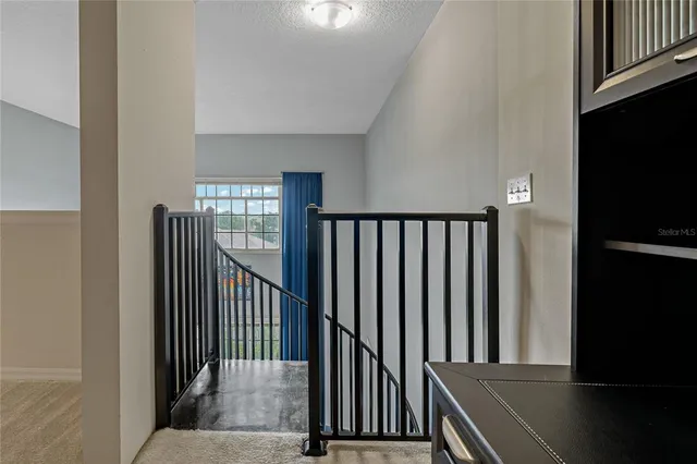 a view of a dining room with furniture wooden floor and a chandelier