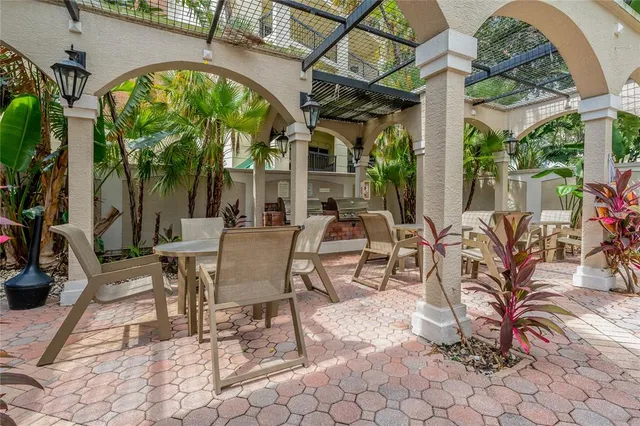a living room with furniture fireplace and a large window