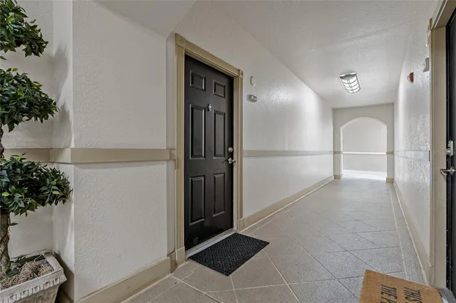 a kitchen with stainless steel appliances granite countertop a sink and a refrigerator