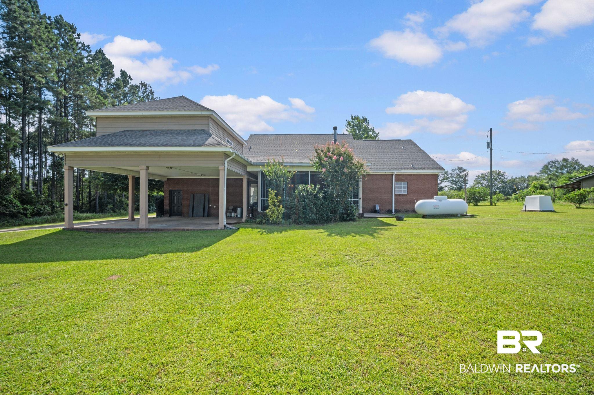 48513 Phillipsville Road Bay Minette, AL 36507 - Photo 45 of 50 Rear view of property featuring a yard, a shingled roof, and brick siding