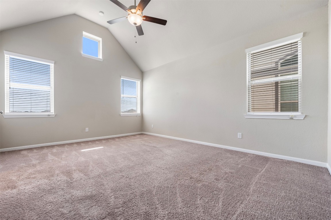 5203 Prairie Terrace Lane Fulshear, TX 77441 - Photo 14 of 32 an empty room with windows and fan
