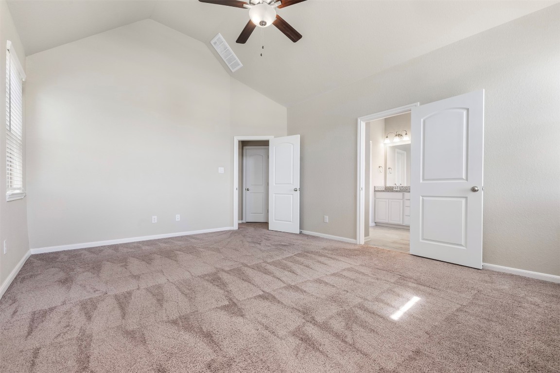 5203 Prairie Terrace Lane Fulshear, TX 77441 - Photo 15 of 32 a view of an empty room with a ceiling fan