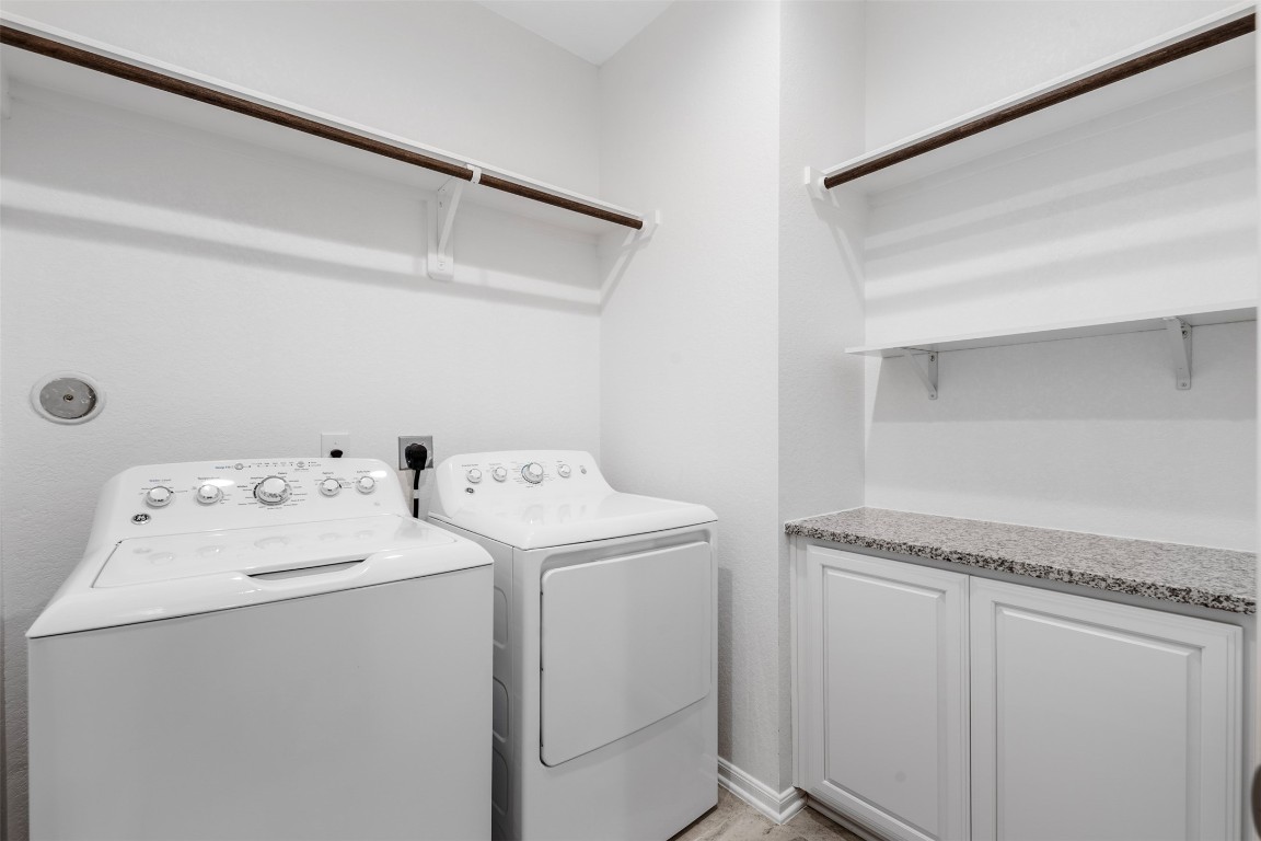 5203 Prairie Terrace Lane Fulshear, TX 77441 - Photo 19 of 32 a utility room with dryer and washer