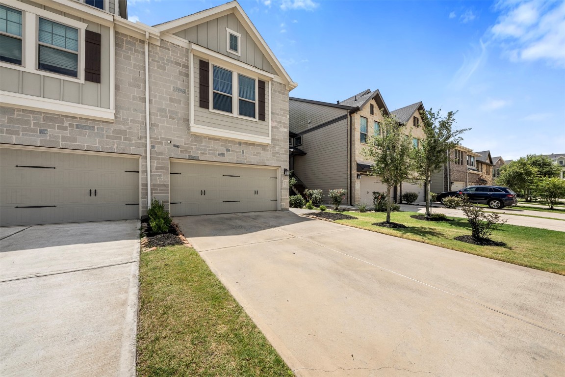 5203 Prairie Terrace Lane Fulshear, TX 77441 - Photo 2 of 32 a view of a house with a backyard