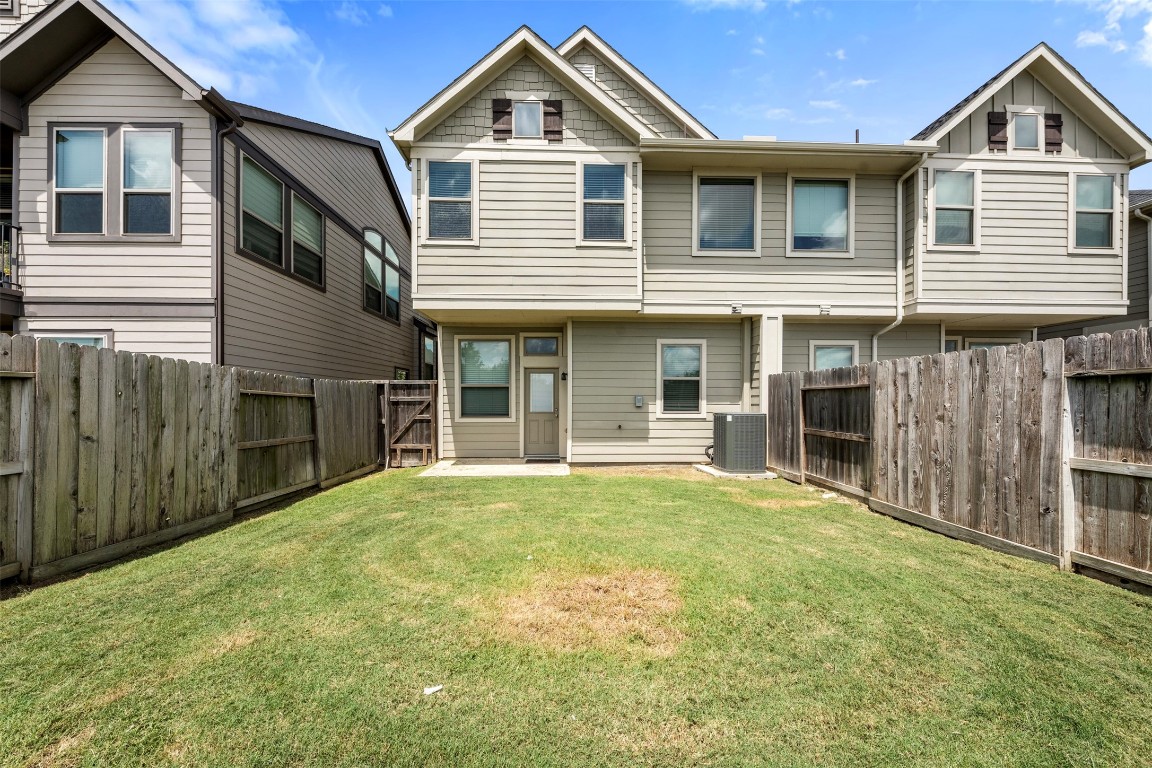 5203 Prairie Terrace Lane Fulshear, TX 77441 - Photo 23 of 32 a front view of a house with a yard and garage