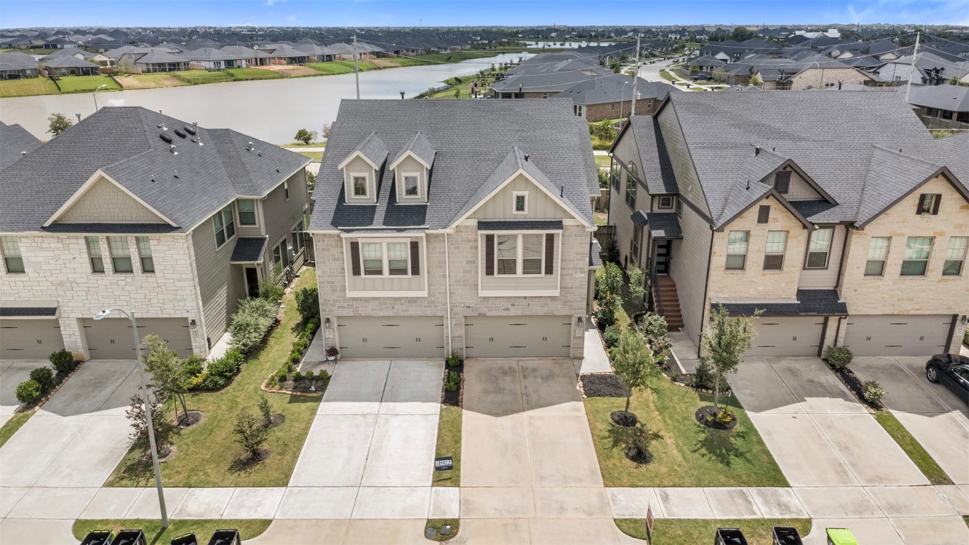 5203 Prairie Terrace Lane Fulshear, TX 77441 - Photo 25 of 32 an aerial view of a house with a ocean view