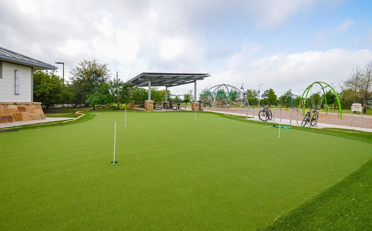5203 Prairie Terrace Lane Fulshear, TX 77441 - Photo 28 of 32 a view of a playground with basketball court
