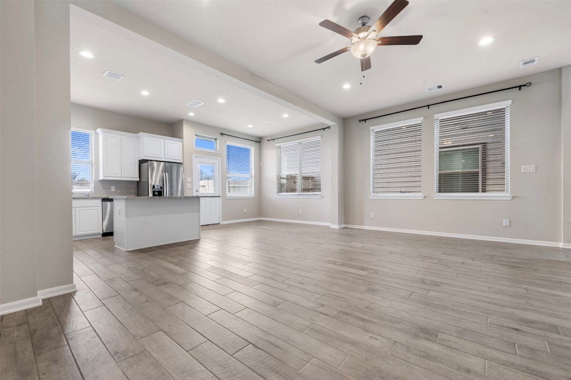 5203 Prairie Terrace Lane Fulshear, TX 77441 - Photo 5 of 32 a view of a kitchen with a sink and a window