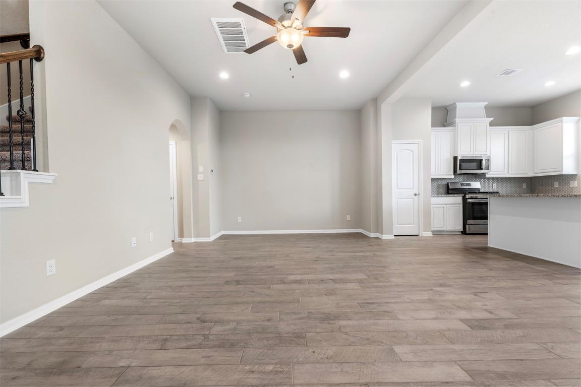 5203 Prairie Terrace Lane Fulshear, TX 77441 - Photo 6 of 32 a view of kitchen with sink microwave and stove top oven
