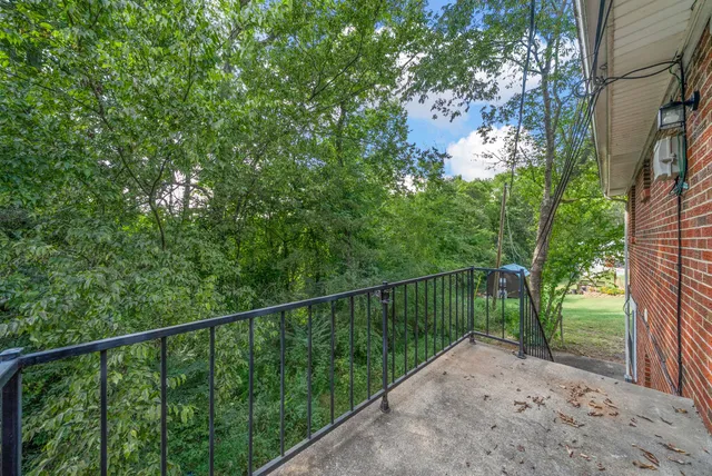 a view of a deck with a forest