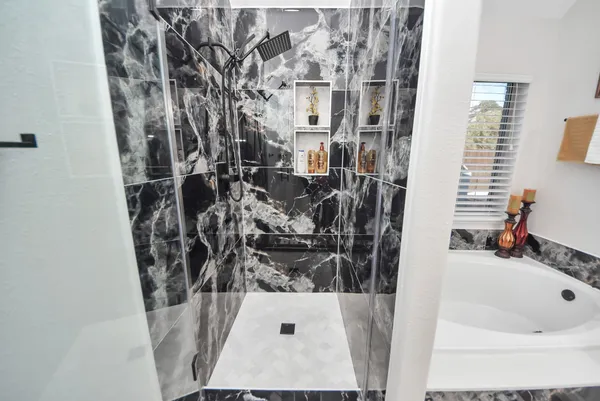 a bathroom with a tub and sink