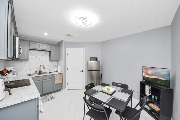 a kitchen with a sink appliances and cabinets