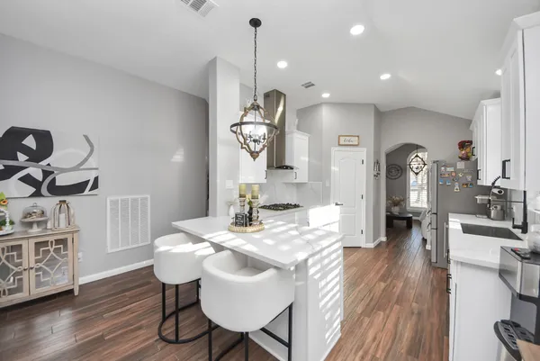 a very nice looking dining room with a table and chairs