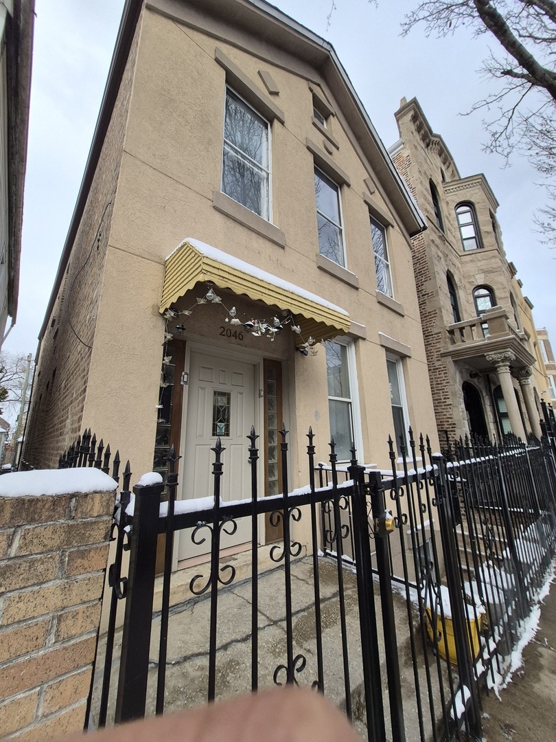 2046 West 19th Street, Unit 2 Chicago, IL 60608 - Photo 2 of 11 a view of a brick building with many windows