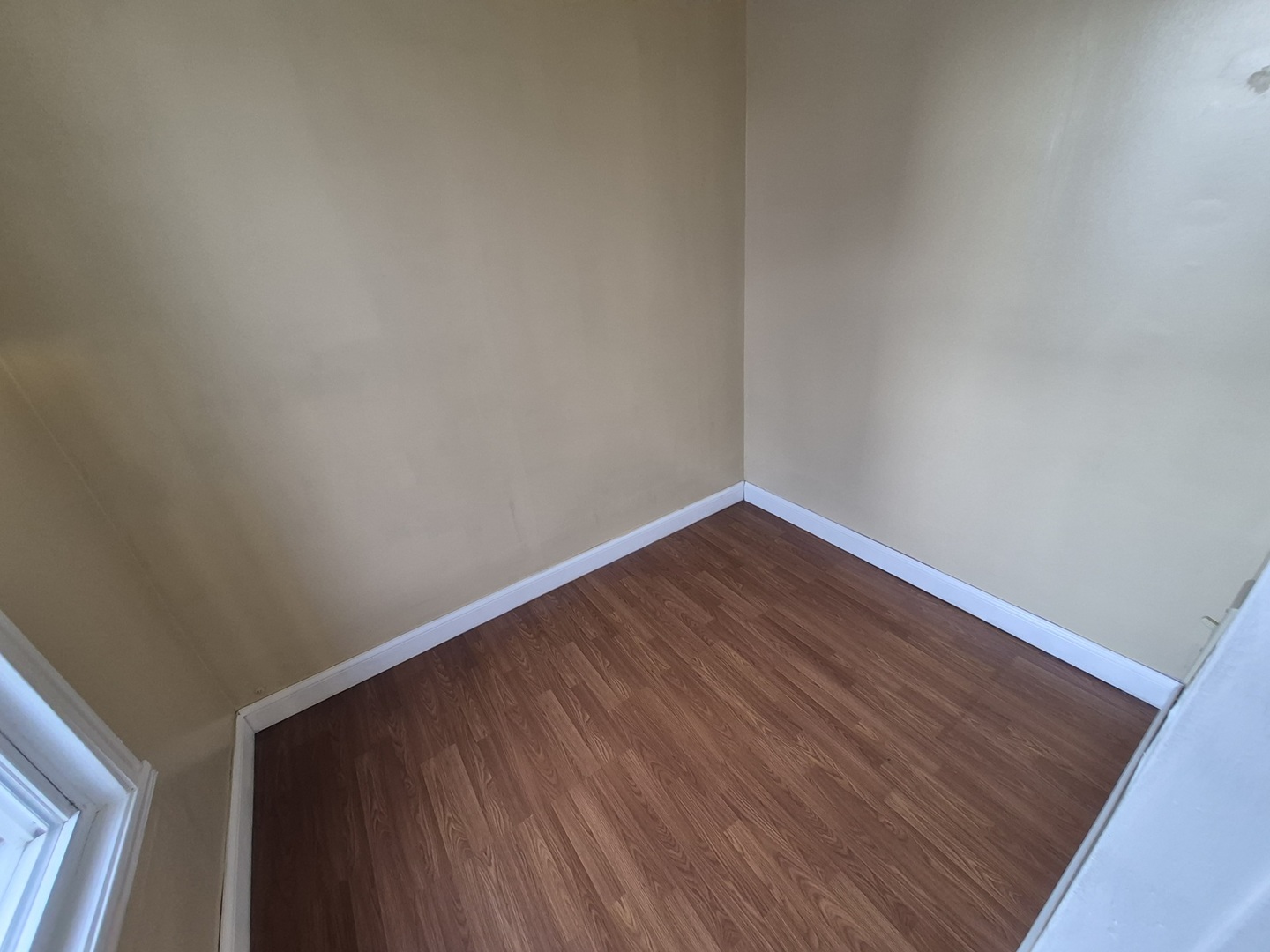 2046 West 19th Street, Unit 2 Chicago, IL 60608 - Photo 4 of 11 a view of an empty room with wooden floor