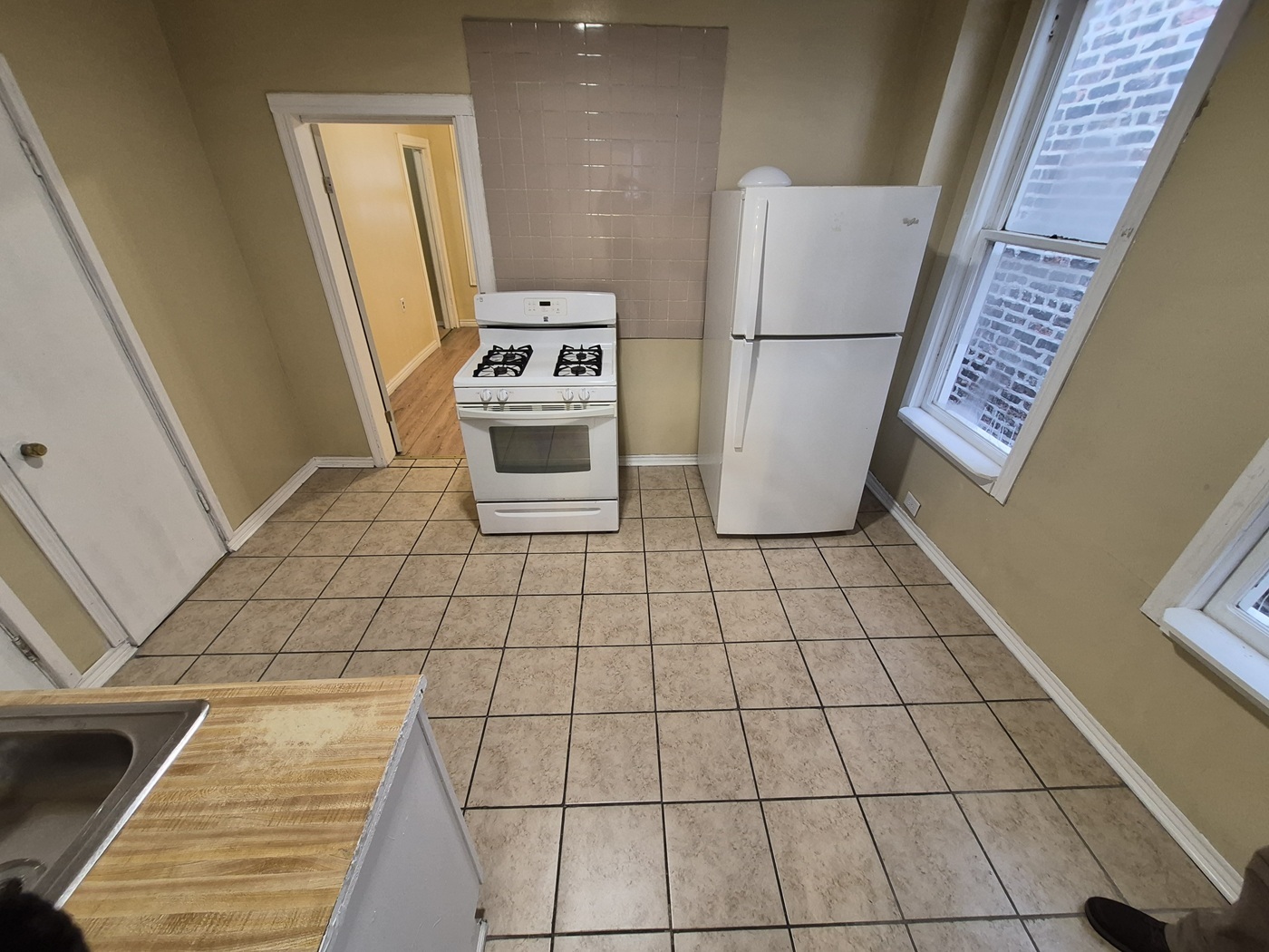 2046 West 19th Street, Unit 2 Chicago, IL 60608 - Photo 6 of 11 a view of kitchen with microwave and refrigerator
