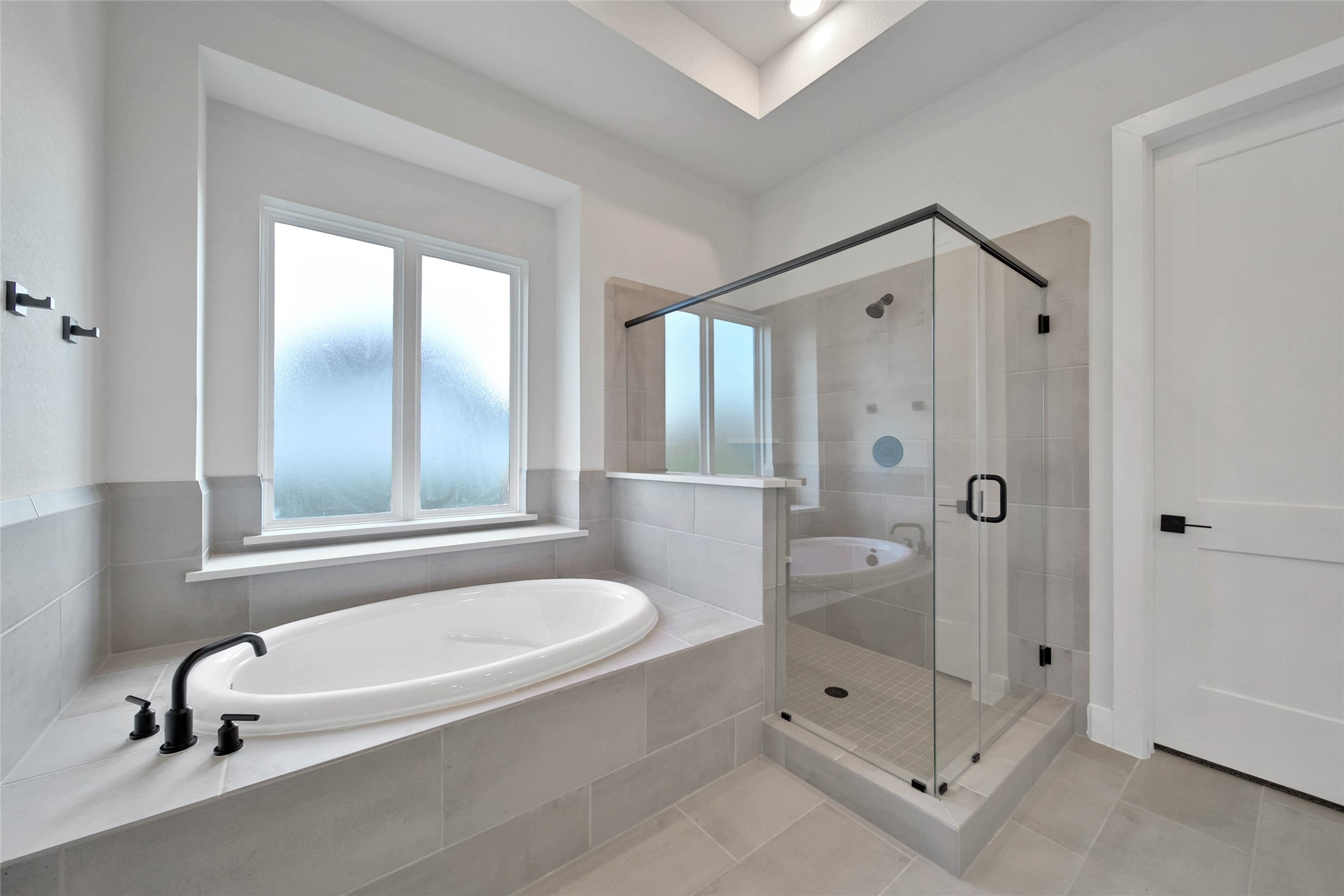 4610 Magnolia Bend Drive Rosharon, TX 77583 - Photo 22 of 48 a bathroom with a tub shower and window