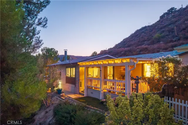 a view of swimming pool with outdoor seating and mountain view