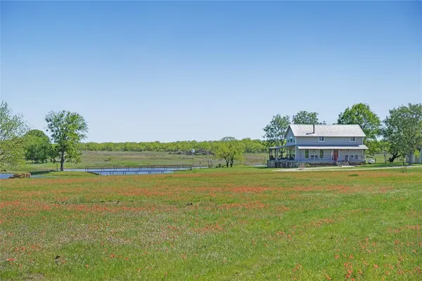 a view of a large body of water with a building in the background