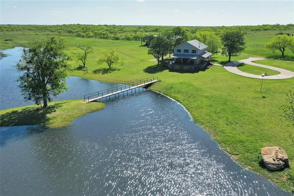 a view of a lake with a garden