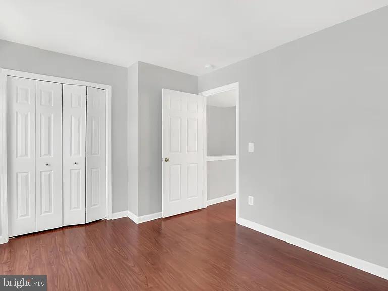 44480 Watertown Terrace Ashburn, VA 20147 - Photo 13 of 22 a view of an empty room with wooden floor