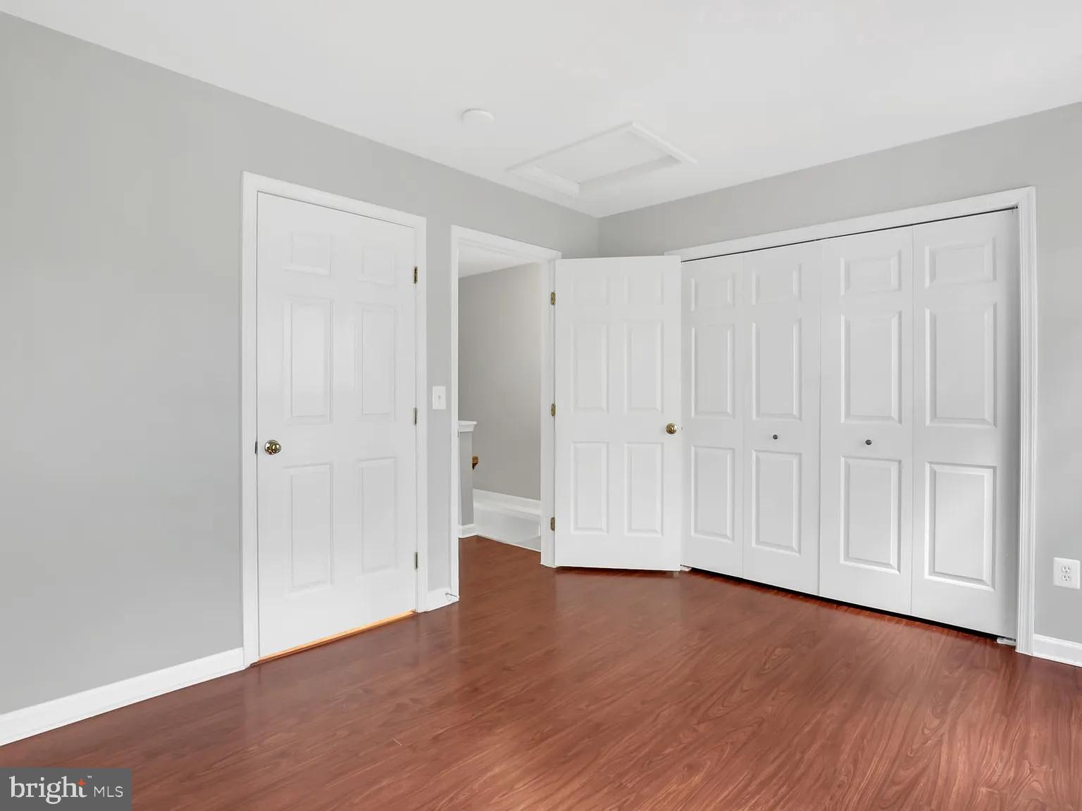 44480 Watertown Terrace Ashburn, VA 20147 - Photo 17 of 22 a view of an empty room with wooden floor